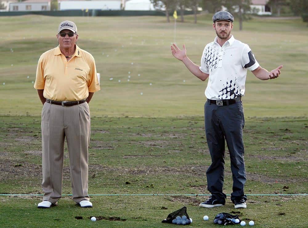 LAS VEGAS - OCTOBER 18:  Golf instructor Butch Harmon (L) and singer Justin Timberlake speak during a golf clinic for kids during the Justin Timberlake Shriners Hospitals for Children Open golf tournament at the TPC Summerlin October 18, 2008 in Las Vegas, Nevada.  (Photo by Ethan Miller/Getty Images for InStyle)