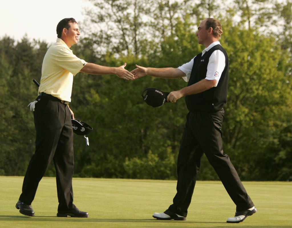 COVENTRY, ENGLAND - MAY 15: Thomas Bjorn of Denmark shakes hands with David Howell of England on the 18th green after winning The Daily Telegraph Dunlop British Masters on the second extra hole after a Three-way play-off against Englishmen Brian Davais and David Howell, at the Forest of Arden Golf Club on May 15, 2005 in Coventry, England. (Photo by Warren Little/Getty Images) *** Local Caption *** Thomas Bjorn;David Howell