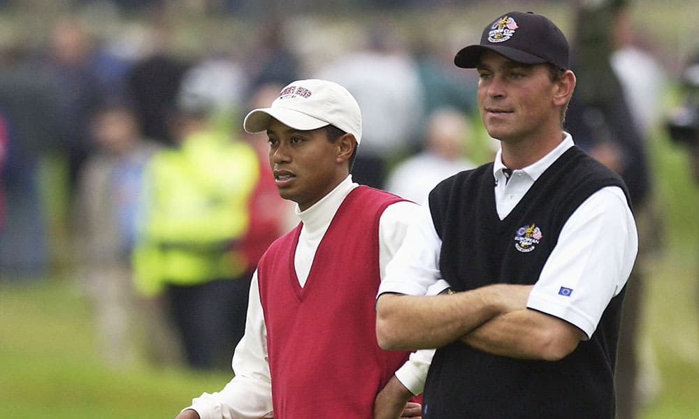 SUTTON COLDFIELD - SEPTEMBER 28: Tiger Woods of the USA with Thomas Bjorn of Europe during the morning foursome matches on the second day of the 34th Ryder Cup at the De Vere Belfry in Sutton Coldfield, England on September 28, 2002. (Photo by Stephen Munday/Getty Images)