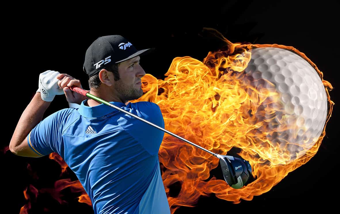 Close up of a burning golf ball flying on a black background ...