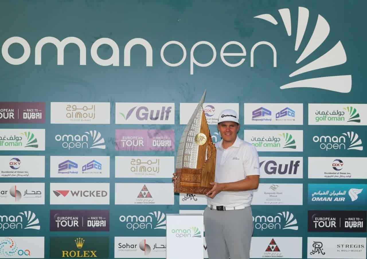 Valimaki with the Oman Open trophy Worldwide Golf